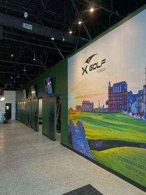 Commercial mural with landscape scene and green accent walls in modern exhibition space